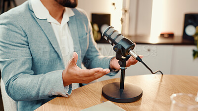 Buy stock photo Hands, microphone and podcast with man in studio for broadcast, interview or live streaming. Radio, subscription entertainment and talk show host at table in production office for presenting