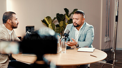 Buy stock photo Podcast, live stream and man with guest in studio for interview, conversation and broadcast for radio show. Content creation, media and presenter with person for recording, hosting and talking