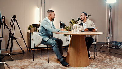 Buy stock photo Podcast, men and talk for interview in studio, business show and laugh at funny joke. Tablet, podcaster and microphone for recording audio with humor, broadcast or live stream for entrepreneur advice