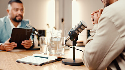 Buy stock photo Podcast, mic and people in studio for interview, conversation and broadcast for radio show. Content creation, hosting and men with notebook for questions, live stream or talking for media presenter