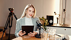 Talk show, microphone and businesswoman in studio with tablet for online subscribers with podcast. Happy, digital technology and female radio host with live streaming, recording or broadcast.