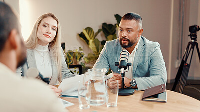 Buy stock photo Podcast, microphone and group of people in studio for financial talk show, radio or live streaming. Investment podcaster, recording audio or host with guests for interview or broadcast with paperwork