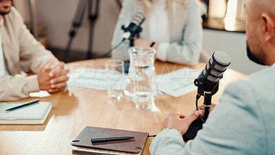 Buy stock photo Podcast, microphone and hands with group of people in studio for talk show, radio or live streaming. Podcaster, recording audio and host with guests for interview, content creation and broadcast