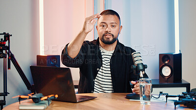 Buy stock photo Portrait, man and speaking with mic for podcast, audio broadcast and live recording in studio. Presenter, laptop and hosting talk show with media production, content creator and radio announcement