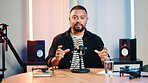 Podcast, mic and portrait of man in home studio for live streaming, info or drone product review. Presenter, recording and talk show with photography, innovation or conversation for technology news