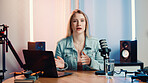 Portrait, woman and speaking with mic for podcast, audio broadcast and live recording in studio. Presenter, laptop and hosting talk show with media production, content creator and radio announcement