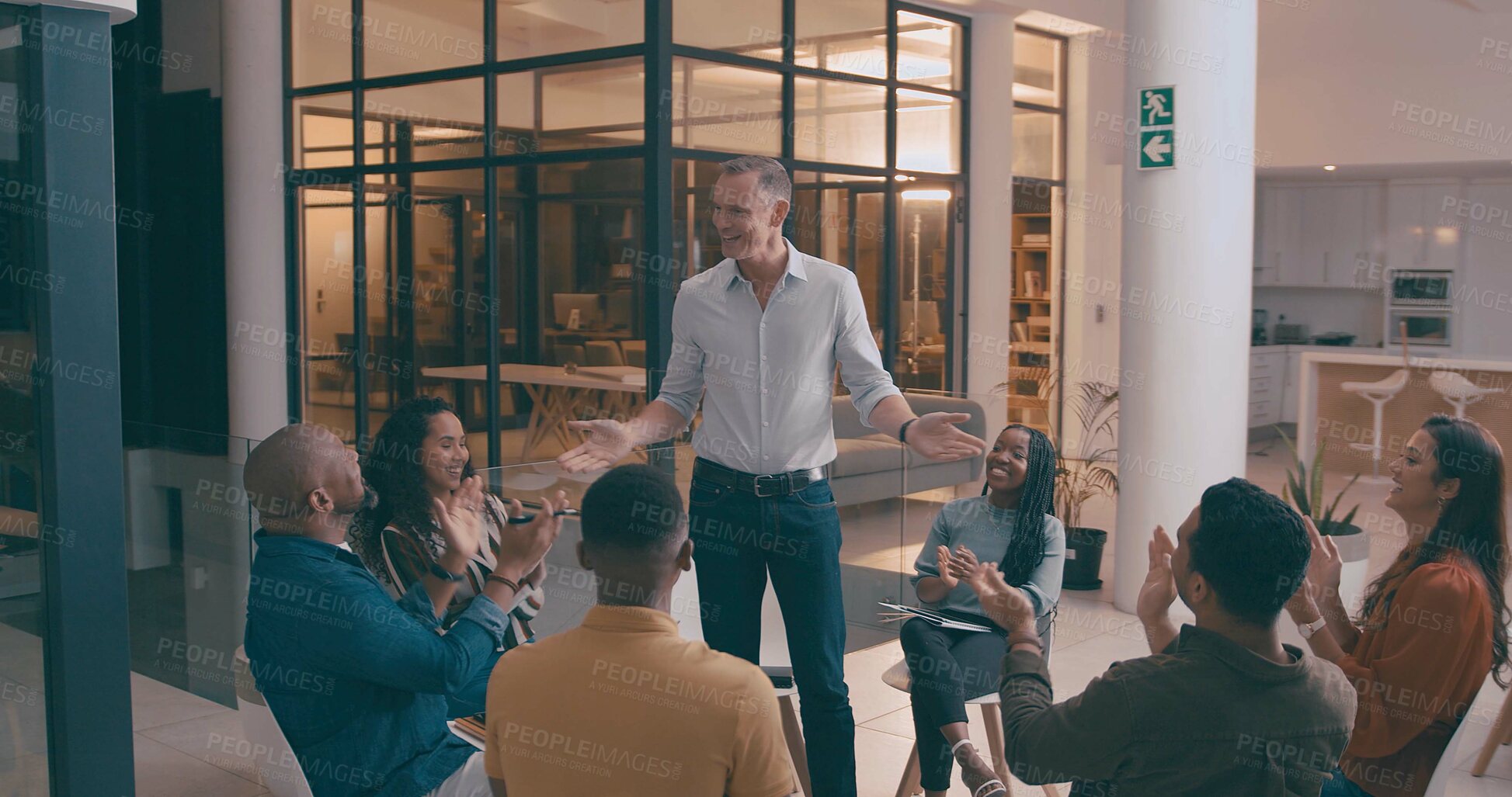 Buy stock photo Mature man, meeting and applause in office for good news, success and winner at night. People, clapping hands and well done for teamwork, congratulations and staff recognition of deadline achievement