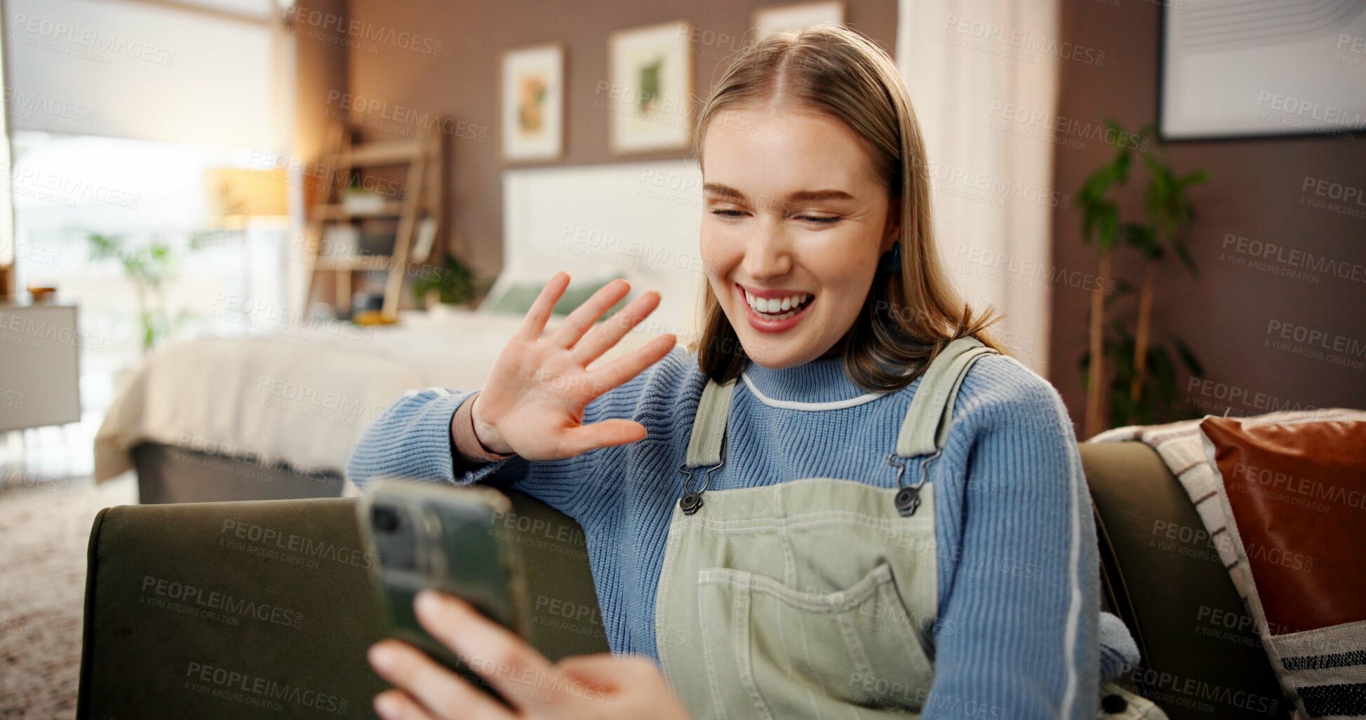 Buy stock photo Phone, video call and woman on sofa in home with communication, contact or networking online. Happy, waving and female person with virtual conversation on cellphone in living room at apartment.