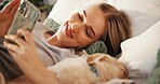 Phone, relax or smile with puppy and woman in bedroom of home together for break or sleeping. App, communication or rest with happy owner and pet labrador in apartment for bonding or social media