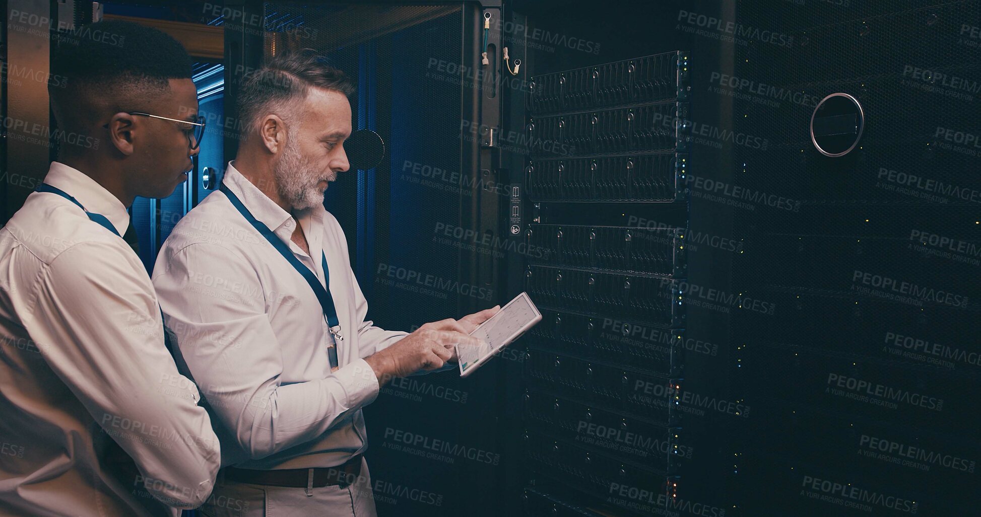 Buy stock photo People, engineer and talk with tablet in server room for programming, software update and maintenance. Men, team and digital for database upgrade, IT inspection and test system for engineering repair
