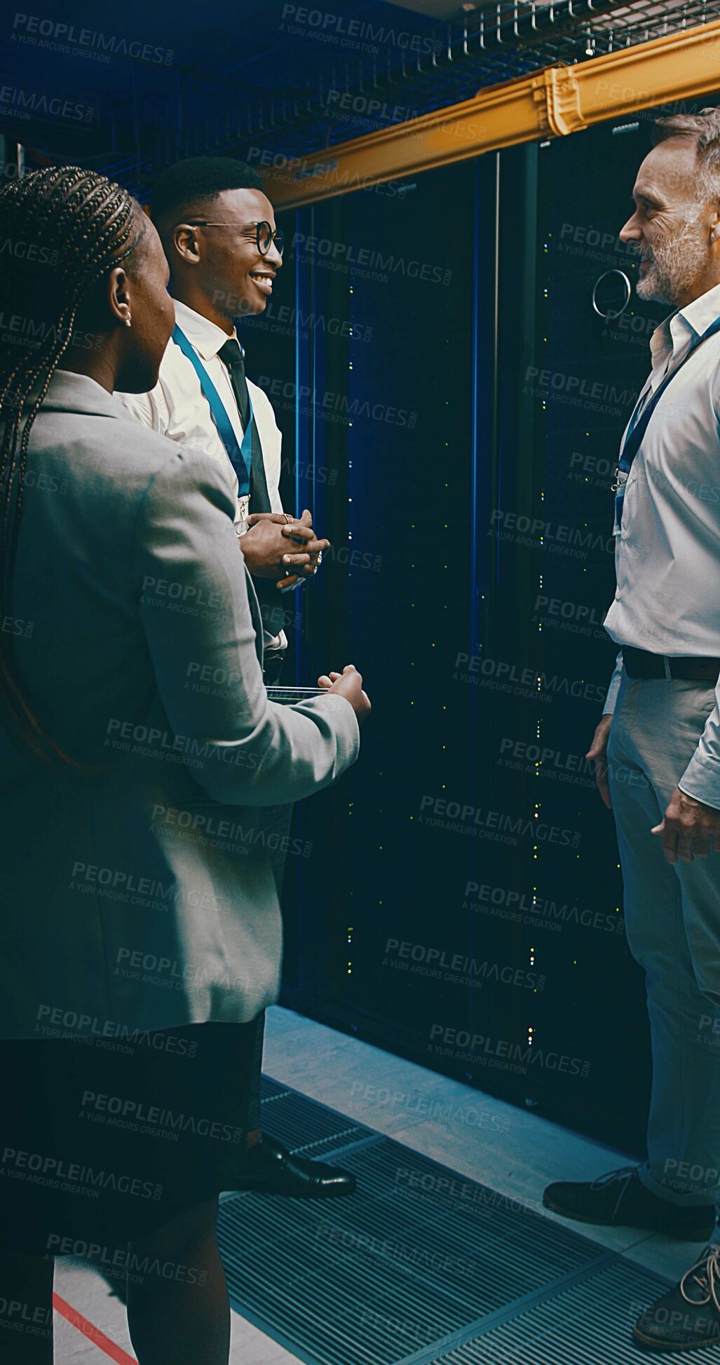 Buy stock photo Happy team, people and talking in server room for system maintenance, diagnostics and planning. Technician group, engineer and discussion with smile in data center for IT support and database update