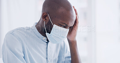 Buy stock photo Black man, face mask and headache in hospital with stress, bacteria infection or healthcare crisis. African person, pain and sick with virus in medical clinic for recovery, check up and anxiety