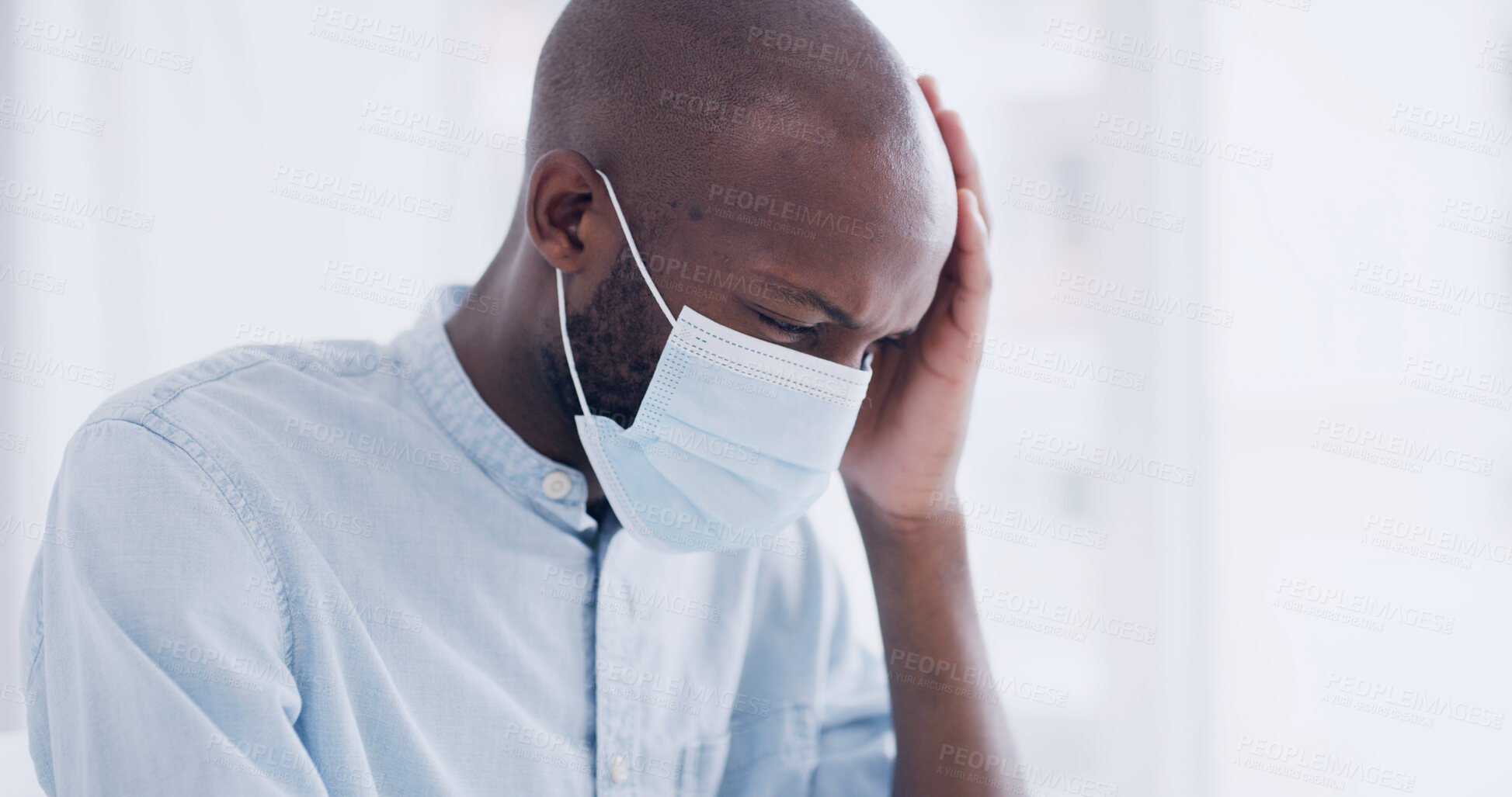 Buy stock photo Black man, face mask and headache in hospital with stress, bacteria infection or healthcare crisis. African person, pain and sick with virus in medical clinic for recovery, check up and anxiety