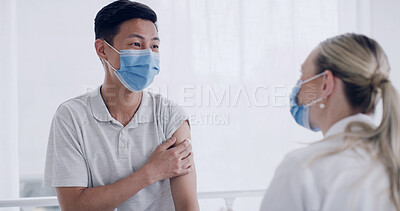 Buy stock photo Man, doctor and talk for flu vaccine at clinic, explain or immune system booster with face mask. Woman, medical professional and patient with ppe, pharmaceutical shot and virus prevention at hospital