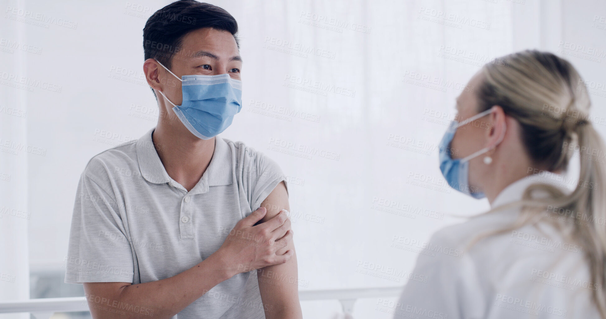 Buy stock photo Man, doctor and talk for flu vaccine at clinic, explain or immune system booster with face mask. Woman, medical professional and patient with ppe, pharmaceutical shot and virus prevention at hospital