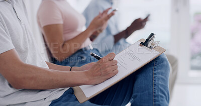 Buy stock photo Hands, person writing on clipboard in waiting room for doctor, medical consultation or insurance form. Patient, filling in paperwork for healthcare registration, information and symptoms of sickness.
