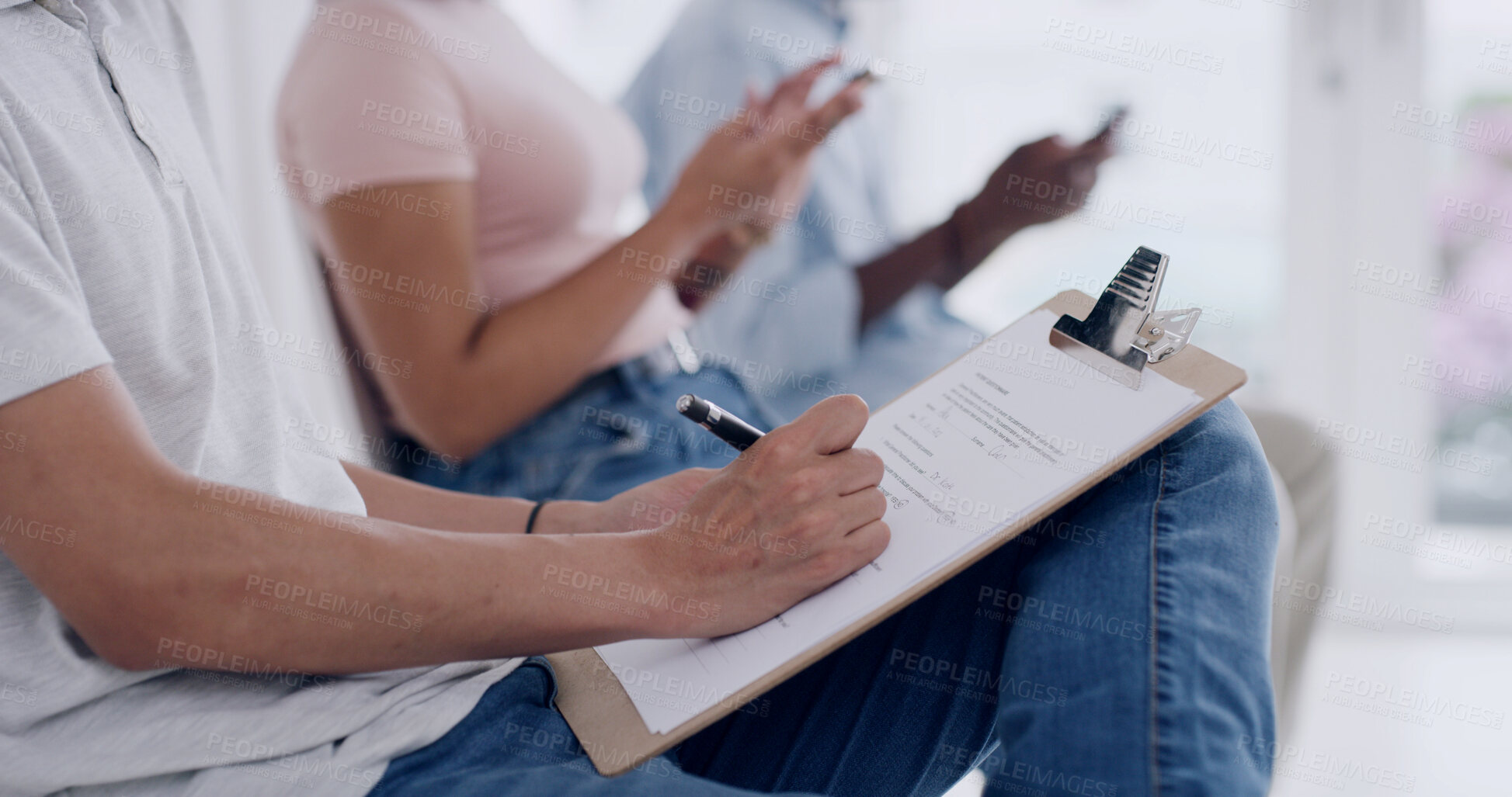 Buy stock photo Hands, person writing on clipboard in waiting room for doctor, medical consultation or insurance form. Patient, filling in paperwork for healthcare registration, information and symptoms of sickness.