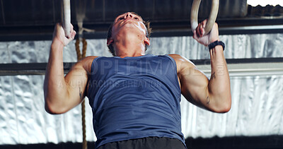 Buy stock photo Athlete, man and exercise with gymnastics rings for fitness, pull up and training for body strength. Male person, equipment and intense workout for weightlifting, muscle endurance and power challenge