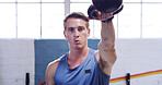 Kettlebell, breathing and man in gym, fitness and challenge with workout, wellness and endurance. Equipment, athlete and person in health center, routine and training with exercise, power and strong