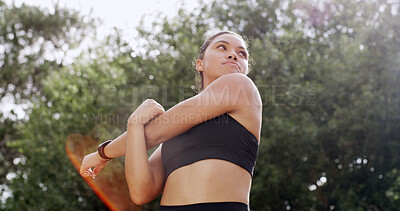 Buy stock photo Woman, warm up and stretching arms in nature for fitness, preparation and thinking for wellness. Outdoor, park and training for exercise with runner, getting ready and flexibility with low angle