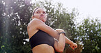 Woman, warm up and stretching in nature for fitness, arms preparation and thinking for wellness. Park, outdoor and training for exercise with runner, getting ready and flexibility with low angle