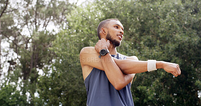 Buy stock photo Fitness, stretching and man outdoor at park for exercise, low angle and training with smile. Male athlete, start arm muscle warm up and happy in nature for workout, wellness and thinking of health