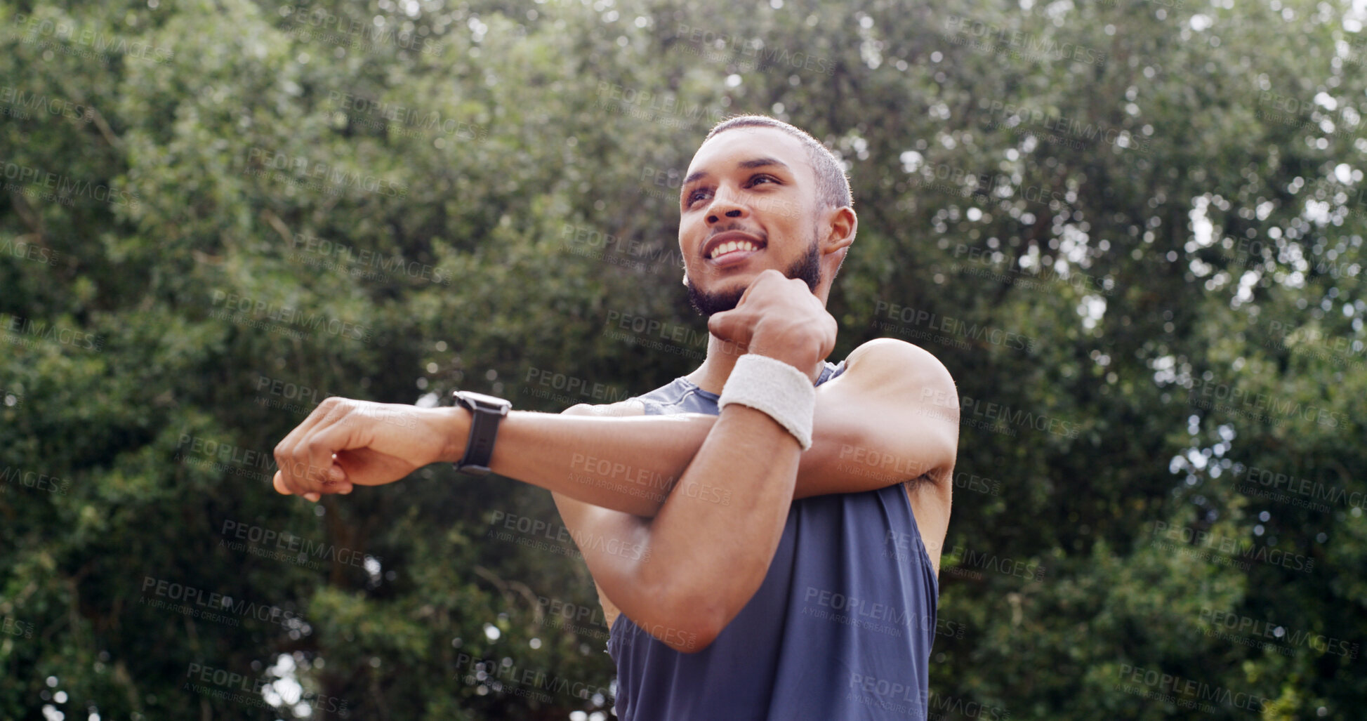 Buy stock photo Fitness, stretching and man thinking outdoor in nature for exercise, training and smile. Male athlete, start arm muscle warm up and happy at park for workout, wellness and low angle of health