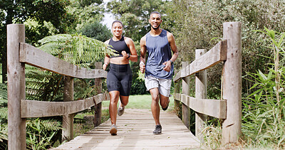 Buy stock photo Smile, couple and running in forest for fitness, team exercise and cardio training. People, runner and sports workout with endurance challenge, marathon practice and wellness competition in nature