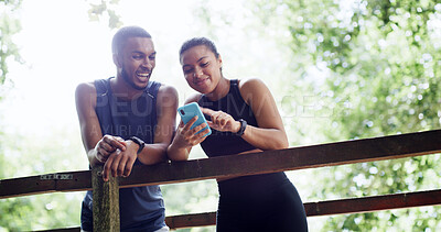 Buy stock photo Hiking, couple and phone on outdoor bridge, digital map or location search for trail navigation. Fitness exercise, below or happy people with flare in nature, conversation or track step on mobile app