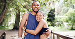 Nature, hug and portrait of couple for fitness, exercise and workout together in morning. Happy, bridge and man with woman embrace for wellness, health and bonding for hobby, training and relax