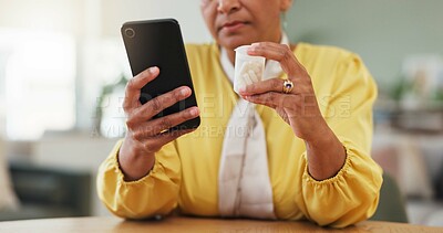 Buy stock photo Hands, phone and search in home with pills for side effects, benefits or label info for prescription. Person, smartphone and web with tablet, medicine and pharmaceutical product for wellness in house