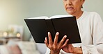 Senior woman, reading and bible in home with study, faith and religion for spiritual journey. Peace, elderly person and christian in house with devotion, gospel book and meditation for comfort.