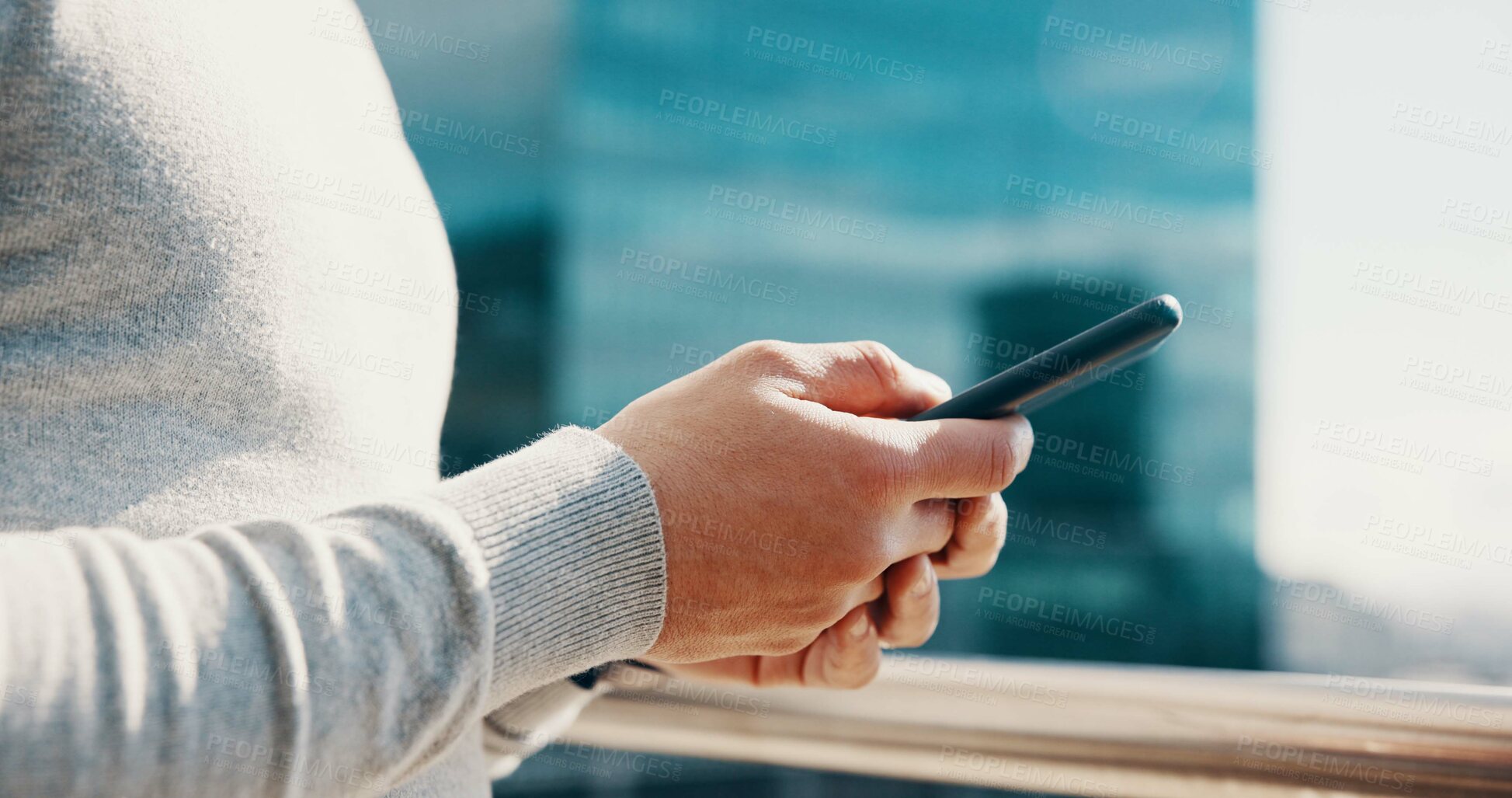 Buy stock photo Businessman, hands and typing with phone on balcony for trading account, economy news or research. City, trader and smartphone at office for stock market portfolio, online investment or communication