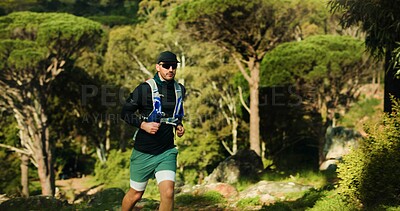 Buy stock photo Running, fitness and man in forest, nature and endurance with wellness, trail and cardio workout. Outdoor, healthy person and runner with exercise, energy and challenge with training and practice