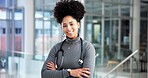 Portrait, woman and surgeon with arms crossed in hospital for career pride, about us and healthcare advice. Happy, person and ambition of medical support, cardiology expert and confident for wellness