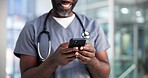 Hands, doctor and phone with texting in hospital for telehealth, online results or check schedule. Surgeon, man and happy with smartphone in clinic for medical research, healthcare app or mobile chat