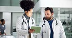 Healthcare, doctor or people with tablet in hallway, patient care file or discussion of results. Brainstorming, treatment plan or physician consulting for medical advice, tech or teamwork in hospital