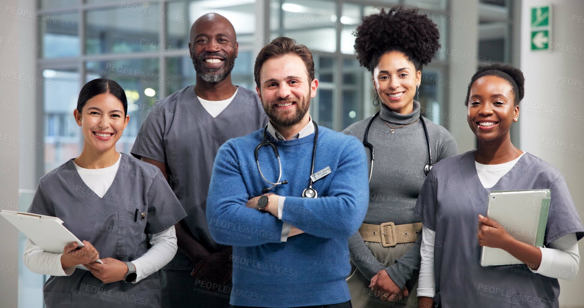 Buy stock photo Doctors, portrait and group with smile, hospital and pride for healthcare service, teamwork or unity. Confident, people and happy for support in clinic, medical professionals and together to help