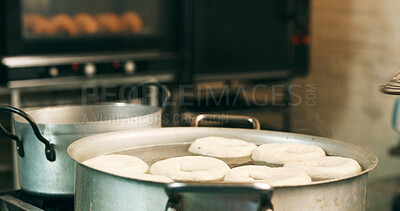 Buy stock photo Bakery, pot and oil in commercial kitchen with doughnuts, cooking and small business. Patisserie, order and quality control for catering, restaurant industry and production for breakfast or snack