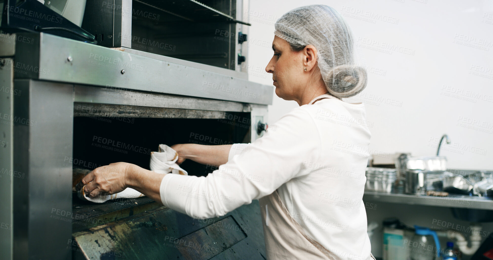 Buy stock photo Restaurant, pastry chef and woman in commercial kitchen with oven, quality control and small business. Baker, order and stock for catering, bakery industry and production for breakfast or snack