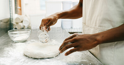 Buy stock photo Baker, hands and pouring water on dough for bread, cooking food and restaurant cuisine. Person, liquid and ingredients in kitchen for hospitality catering, meal prep and gluten free sourdough recipe.
