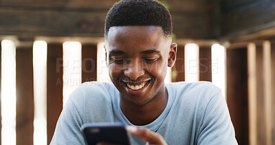 Buy stock photo Texting, laugh and black man outdoor with phone, meme reaction and message reply on social media. Digital, gif or male person outside with tech, video streaming or entertainment browsing on internet.
