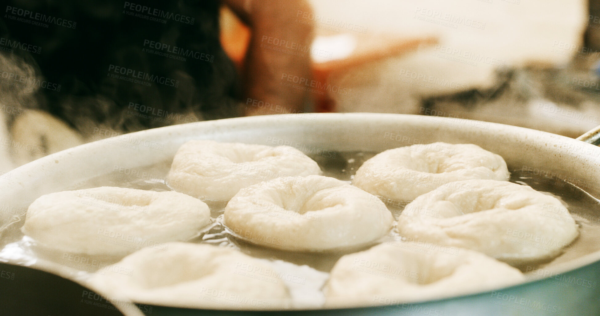 Buy stock photo Bakery, pot and doughnuts in commercial kitchen with fryer, cooking and small business. Patisserie, person and quality control for catering, restaurant industry and production for breakfast or snack