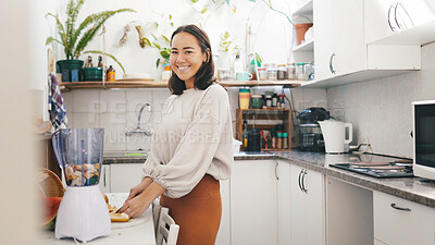 Buy stock photo Cutting, fruit and woman with blender, portrait and preparing smoothie with ingredients for wellness. Kitchen, nutrition and person with equipment for protein shake, gut health and detox in home