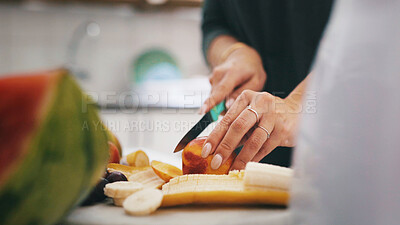 Buy stock photo Fruit, cutting board and hands of woman in kitchen of home for health, breakfast and meal prep. Nutrition, wellness and vitamins with person and knife in apartment for vegan diet, snack and food