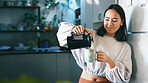 Woman, french press and coffee in kitchen, home and pride with warm beverage, mug and smile. Person, cup and filter kettle with morning routine, confident or happy for caffeine drink at apartment