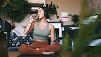 Drinking water, yoga and meditation with woman, smartphone and hydration with fitness. Home, break and healthy person with cellphone, thirsty and liquid with wellness, detox and rest with exercise