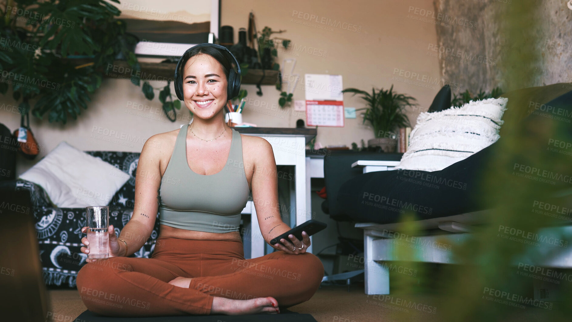 Buy stock photo Home, portrait and water with woman, yoga and smile with smartphone, relax and exercise. Apartment, yogi and healthy person on floor, happiness and wellness with routine, hydration and liquid