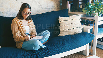 Buy stock photo Writing, notes and woman in lounge, creative and planning for novel on couch, inspiration and ideas. Home, writer and person with notebook for brainstorming, relax and artist with project on sofa