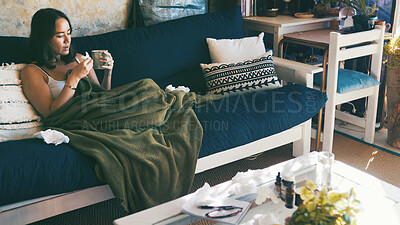 Buy stock photo Home, sick and woman on sofa, tea and tissue with stress, fatigue and illness. Healing, medication and person on couch, blanket and disease with virus, herbal drink and ginger treatment in lounge